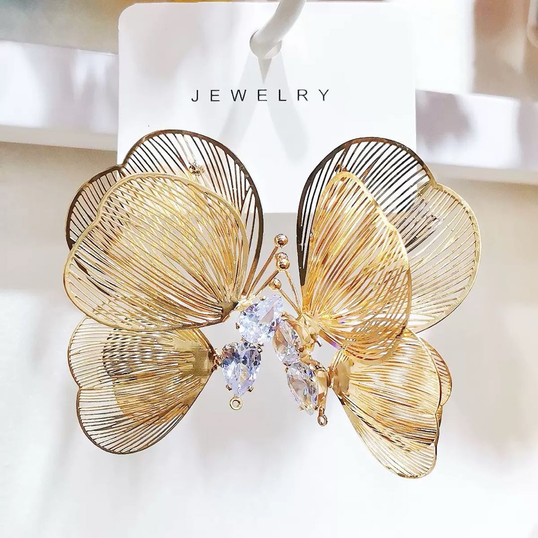 Exaggerated and dazzling golden butterfly stud earrings